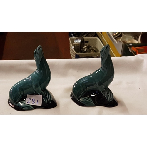 281 - Pair of Poole Pottery Sitting Seals.