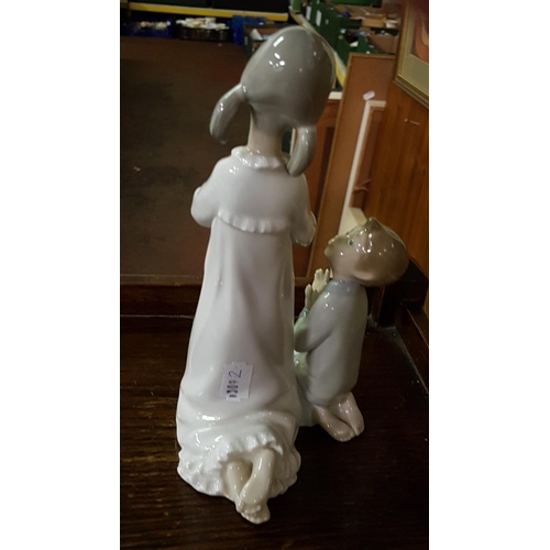 318 - Lladro Kneeling Boy & Girl Figure - approx 8