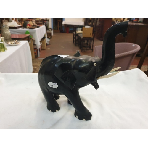 419 - Ebonised Carved Wooden Elephant.