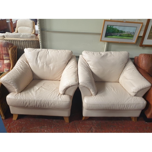530 - Pair of Cream Leather Effect Arm Chairs with Oak Feet - approx 1.3m wide.