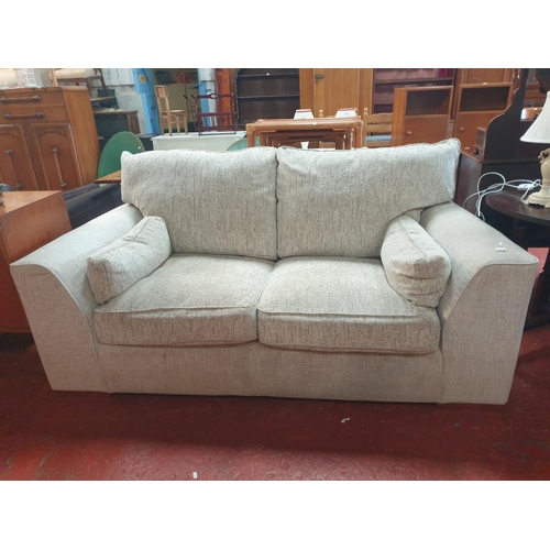 558 - Natural Coloured Upholstered Two Seater Settee - approx 6ft 4