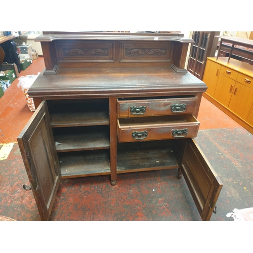 614 - Carved Back Mahogany Finished Two Drawer, Two Door Sideboard - approx 48