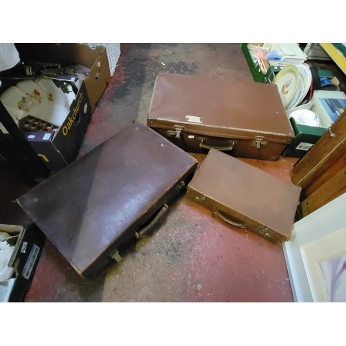 62 - Three Graduated Vintage Brown Suitcases.