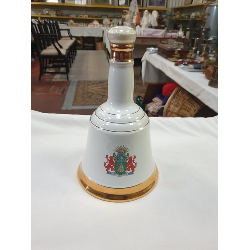 207 - Sealed Wade Commemorative Porcelain Bell's Scotch Whiskey Decanter with Contents.