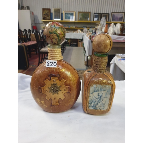 220 - Two Italian Leather Clad Bottles with Stoppers.