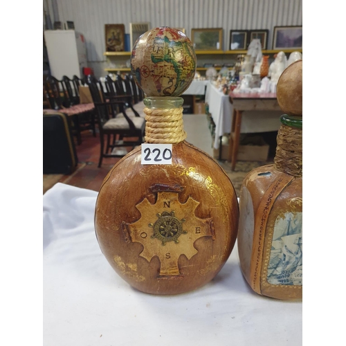 220 - Two Italian Leather Clad Bottles with Stoppers.