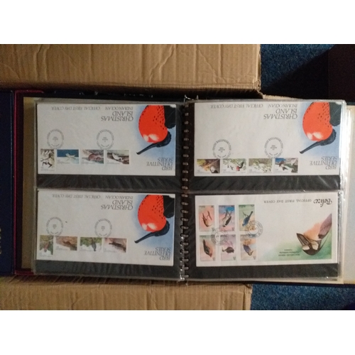 4 - Large box containing 5 albums  GB FDC's and 4 albums of Jersey and Guernsey FDC's. Est £10-15