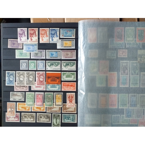 130 - A 16/32 page/side stock book of world stamps - mostly mint/un-mounted.  USA, Europe, French Colonies... 