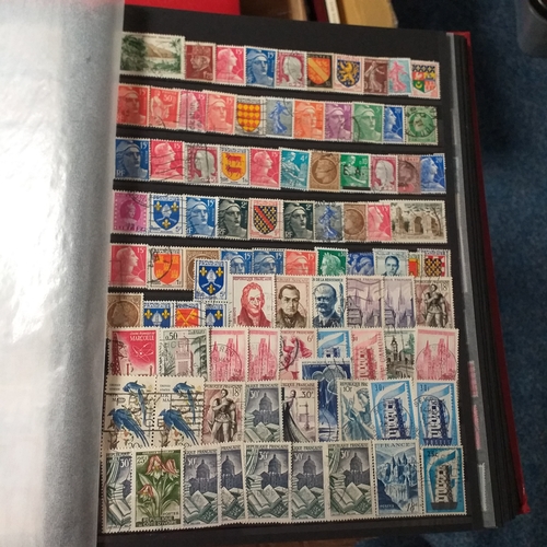 148 - 2 x 32/64 page/side red stock books housing a useful selection of mainly all world issues MNH/mint i... 