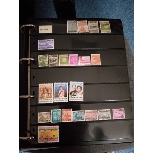 128 - World collection in 2 large 4 ring binders.  Mint/used issues on Hagners/lighthouse/vario plastic st... 