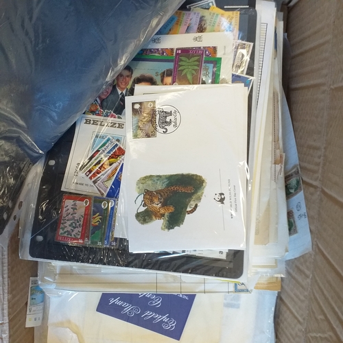 41 - Glory box with 100's of packets of stamps on album pages, wide selection viewing required.