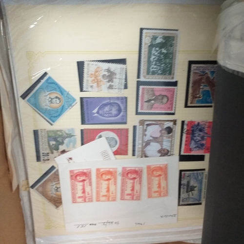 41 - Glory box with 100's of packets of stamps on album pages, wide selection viewing required.