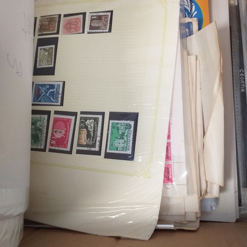 41 - Glory box with 100's of packets of stamps on album pages, wide selection viewing required.