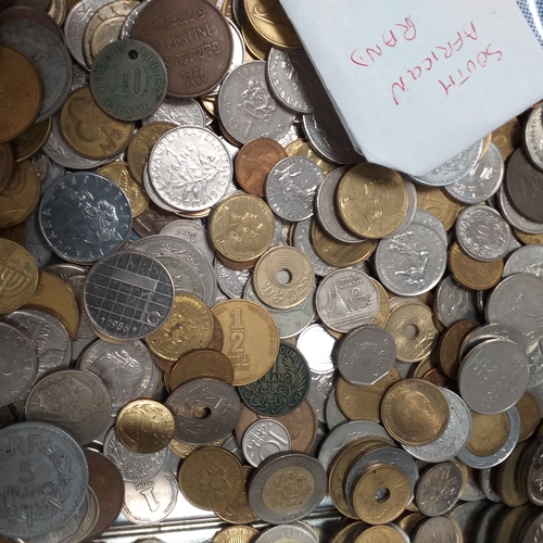 22 - Tin of world coins - 2.5kg approimately