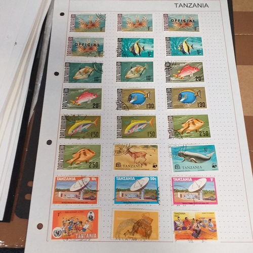 297 - Tanganika / Tanzania collection on 20+ album pages / stock cards, single sheet of KGV issues with va... 