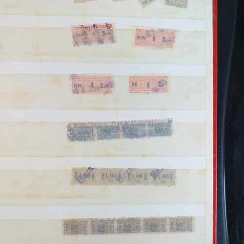 150 - An A5 size 8/16 page/side stock book of East German Trade Union Revenues - an unusual lot,.