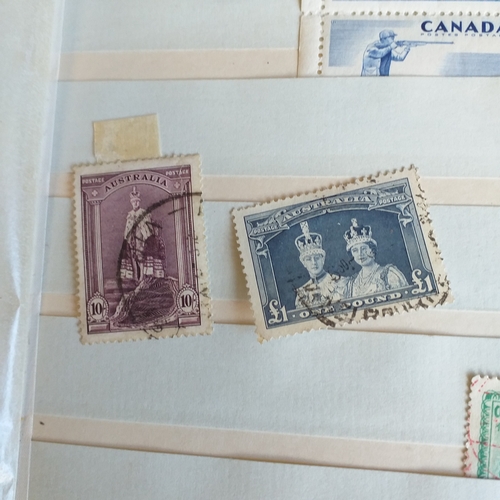 140 - Small 8 page/16 side blue stock book with a selection of odds & sods - early US, GB 2 x embossed iss... 