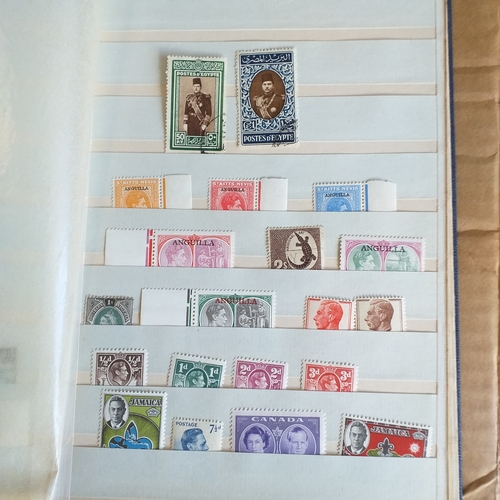 140 - Small 8 page/16 side blue stock book with a selection of odds & sods - early US, GB 2 x embossed iss... 