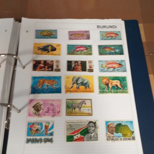 128 - African Countries in a 4 ring binder including Benin, Burkina Faso, Burundi, Congo, Equatorial Guine... 