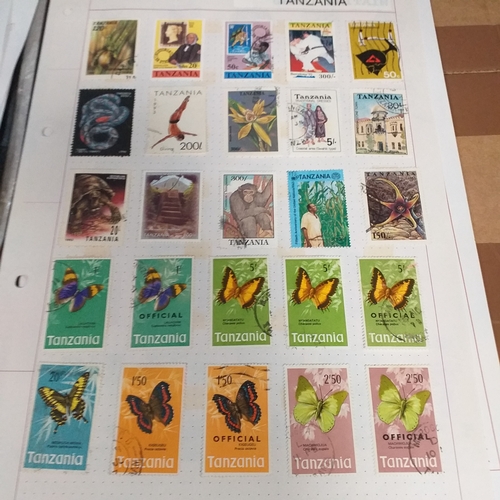 49 - Tanganika / Tanzania collection on 20+ album pages / stock cards, single sheet of KGV issues with va... 
