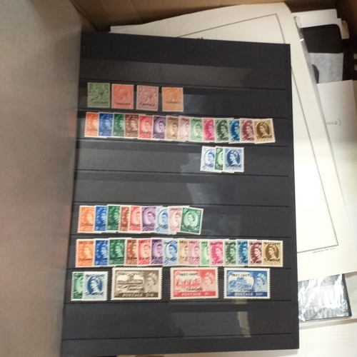 1 - Box containing a huge selection of stamps on leaves and album pages, collections a number of which a... 