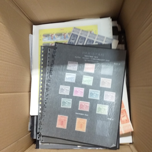 1 - Box containing a huge selection of stamps on leaves and album pages, collections a number of which a... 