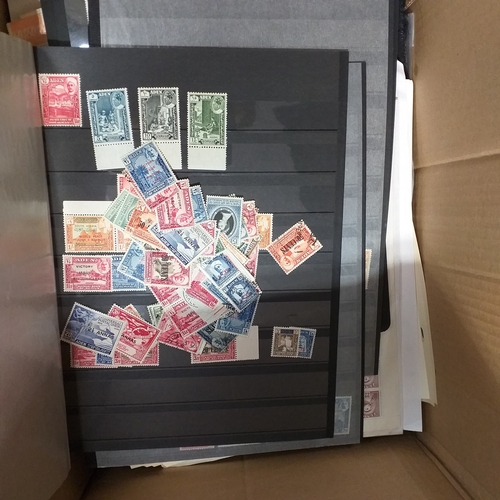 1 - Box containing a huge selection of stamps on leaves and album pages, collections a number of which a... 