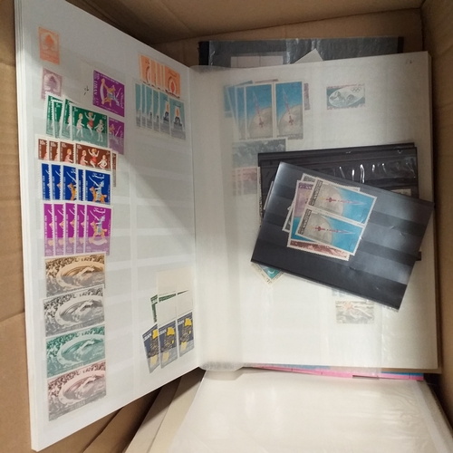 1 - Box containing a huge selection of stamps on leaves and album pages, collections a number of which a... 