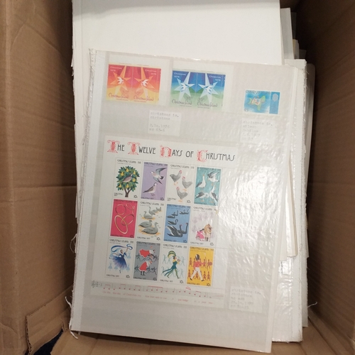 1 - Box containing a huge selection of stamps on leaves and album pages, collections a number of which a... 