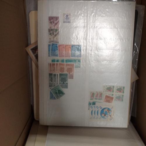 1 - Box containing a huge selection of stamps on leaves and album pages, collections a number of which a... 