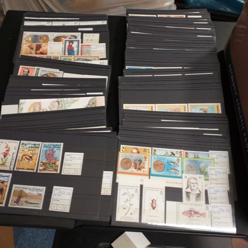 15 - Small box containing 250+/-  3 row stock cards with world sets and singles, all identified and price... 