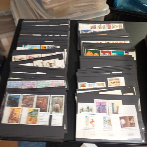 15 - Small box containing 250+/-  3 row stock cards with world sets and singles, all identified and price... 