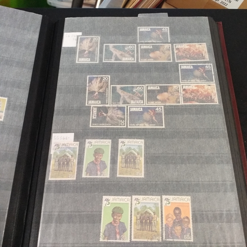 12 - Box: 6 Stock books and albums, contain collections from Jamaica, Malaysia, Football thematics and 2 ... 