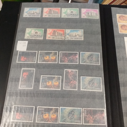 12 - Box: 6 Stock books and albums, contain collections from Jamaica, Malaysia, Football thematics and 2 ... 