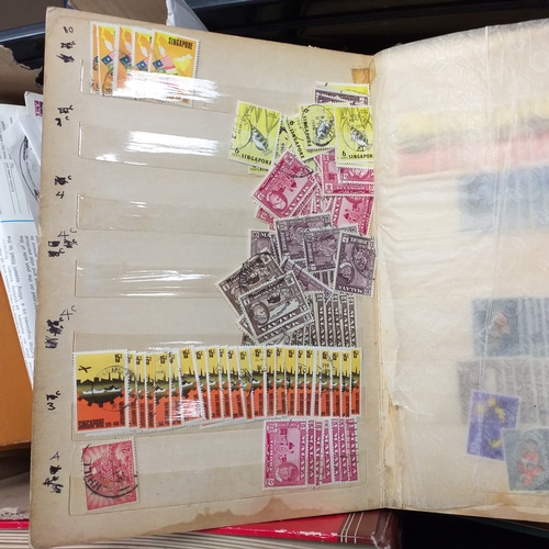 24 - Black plastic carton housing a small collection of albums and bags of stamps/covers etc, mostly SE A... 