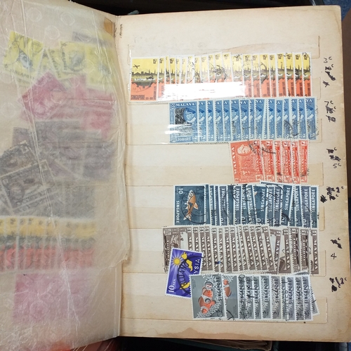24 - Black plastic carton housing a small collection of albums and bags of stamps/covers etc, mostly SE A... 