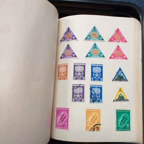 24 - Black plastic carton housing a small collection of albums and bags of stamps/covers etc, mostly SE A... 