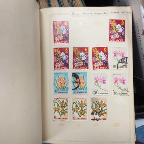 24 - Black plastic carton housing a small collection of albums and bags of stamps/covers etc, mostly SE A... 