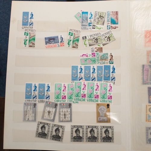 24 - Black plastic carton housing a small collection of albums and bags of stamps/covers etc, mostly SE A... 