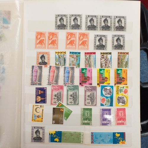 24 - Black plastic carton housing a small collection of albums and bags of stamps/covers etc, mostly SE A... 