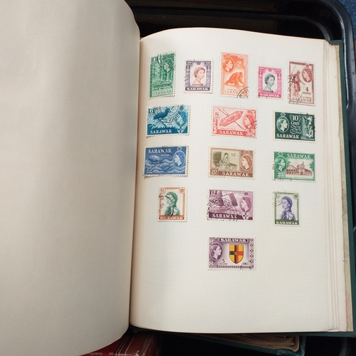 24 - Black plastic carton housing a small collection of albums and bags of stamps/covers etc, mostly SE A... 