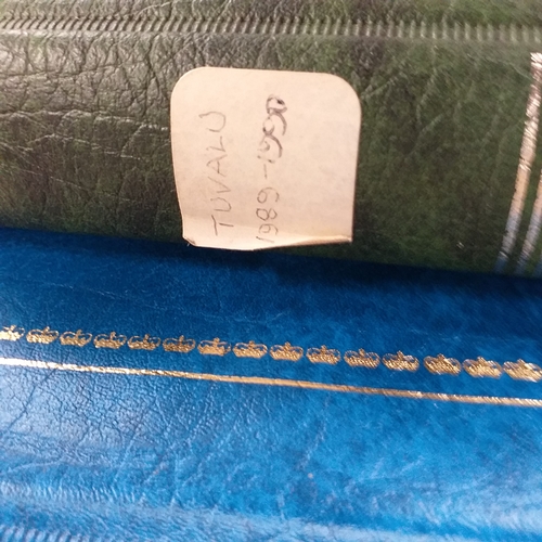 20 - Storage box housing a collection of albums includes Tuvalu, Guernsey, Singapore, South Africa, Israe... 