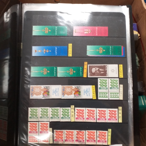 20 - Storage box housing a collection of albums includes Tuvalu, Guernsey, Singapore, South Africa, Israe... 