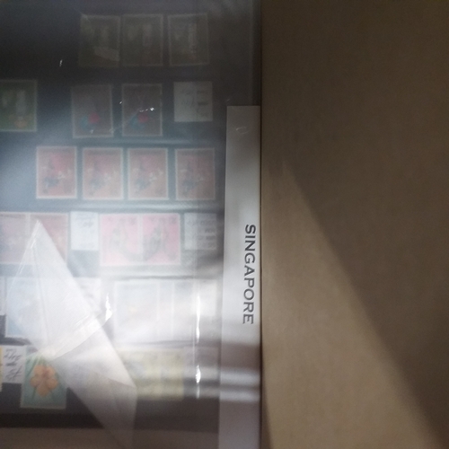 20 - Storage box housing a collection of albums includes Tuvalu, Guernsey, Singapore, South Africa, Israe... 