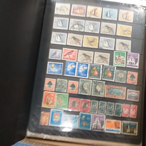 21 - Storage box housing a collection of albums includes South Africa, USA, Greece, Germany, GB, world se... 