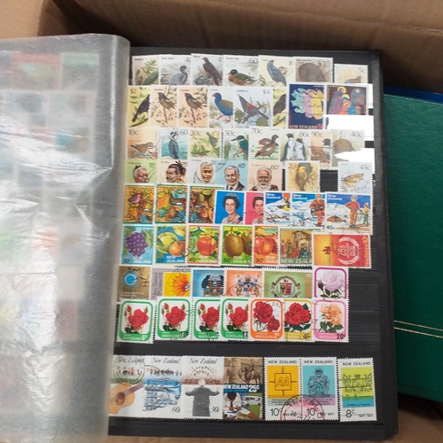 29 - Box containing 5 collections. New Zealand from early to modern used in 8 page stock book, South Afri... 