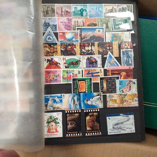29 - Box containing 5 collections. New Zealand from early to modern used in 8 page stock book, South Afri... 