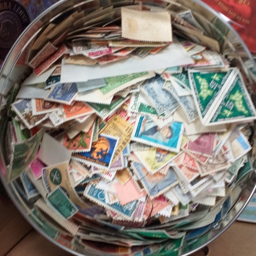 32 - Glory box full of world stamps unsorted in chocolate boxes and tins. 1000's of stamps, well worth a ... 