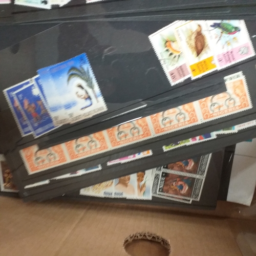 32 - Glory box full of world stamps unsorted in chocolate boxes and tins. 1000's of stamps, well worth a ... 