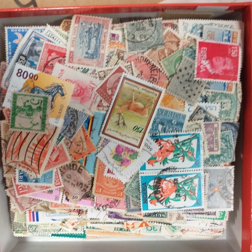 32 - Glory box full of world stamps unsorted in chocolate boxes and tins. 1000's of stamps, well worth a ... 